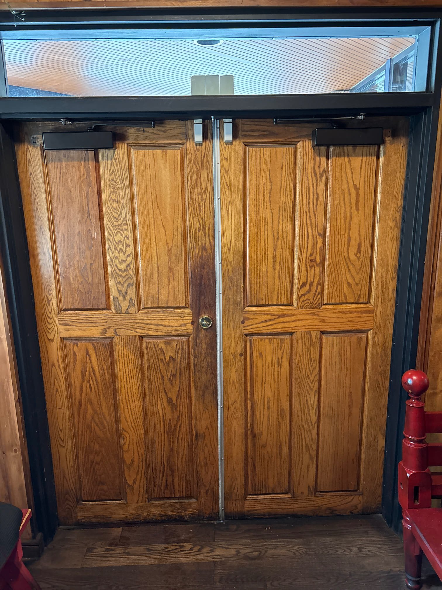 Entrance door repair — surface closer replacement on heavy wooden front door 07 16A